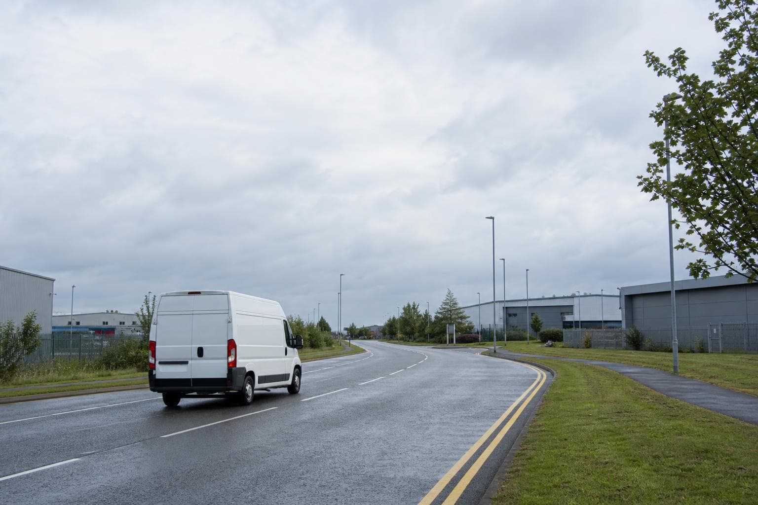 Courier handling a prepared consignment in Billericay, with busy suburban commerce, offices and residential avenues forming the local backdrop
